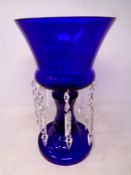 A blue glass table lustre