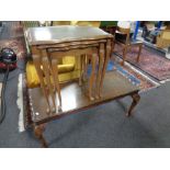 A mahogany pie-crust edge coffee table on Queen Anne style legs together with a similar nest of