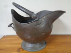 A Victorian copper coal scuttle