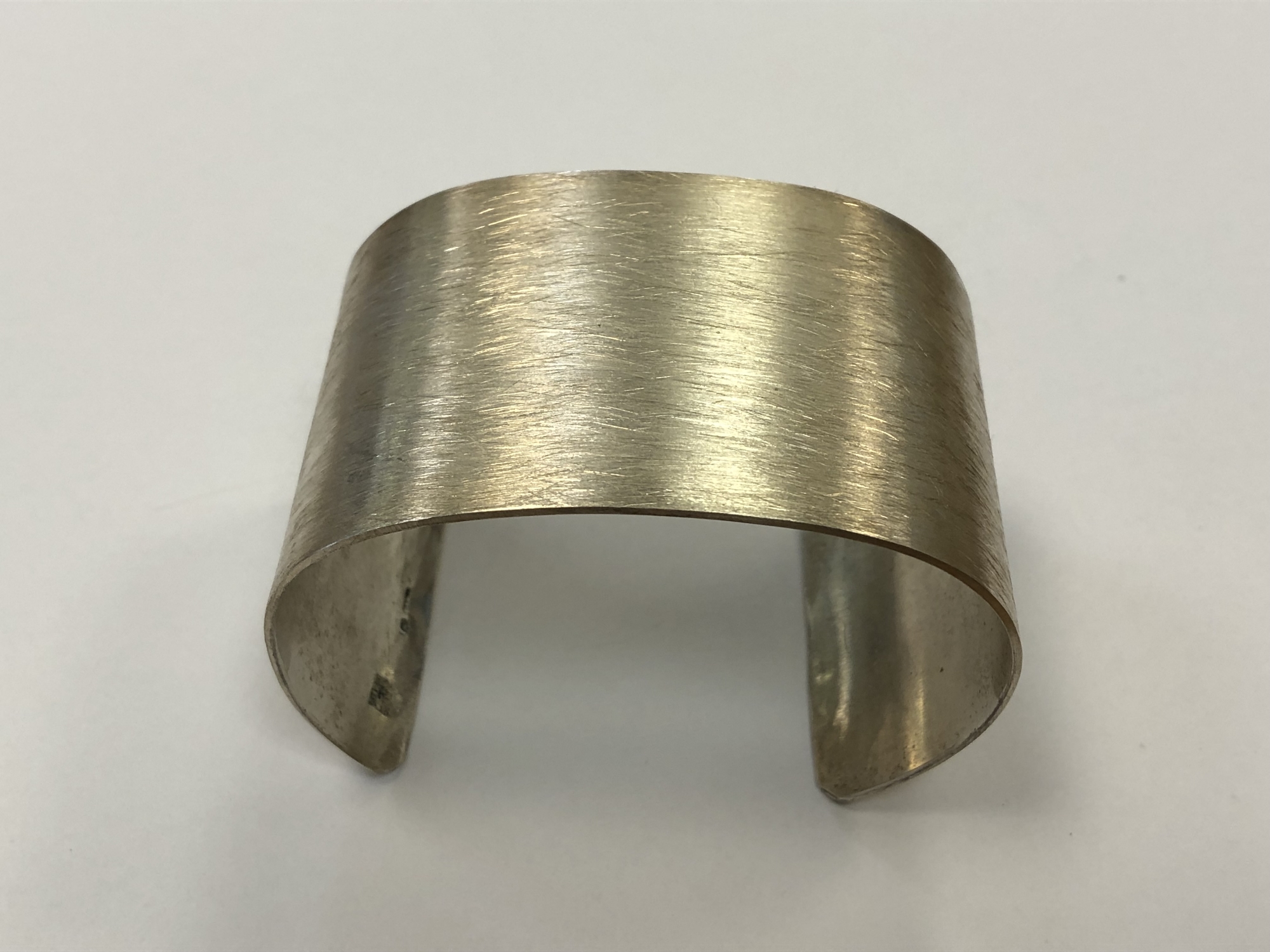 A textured silver bangle CONDITION REPORT: 58g