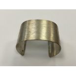 A textured silver bangle CONDITION REPORT: 58g