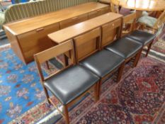 A mid century teak six piece dining room suite comprising of cocktail sideboard,