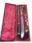 A Victorian three part carving set with antler handles by Thomas Turner & Co, Sheffield, cased.