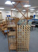 A pine wine rack together with a wooden lattice five tier shelving unit and further set of cubed