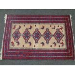 An Afghan rug of geometric design,