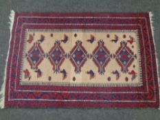 An Afghan rug of geometric design,