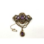 An ornate Victorian pinchbeck brooch