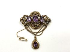 An ornate Victorian pinchbeck brooch