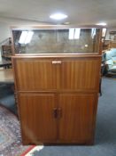 A 20th century mahogany secretaire cabinet fitted with shelves above
