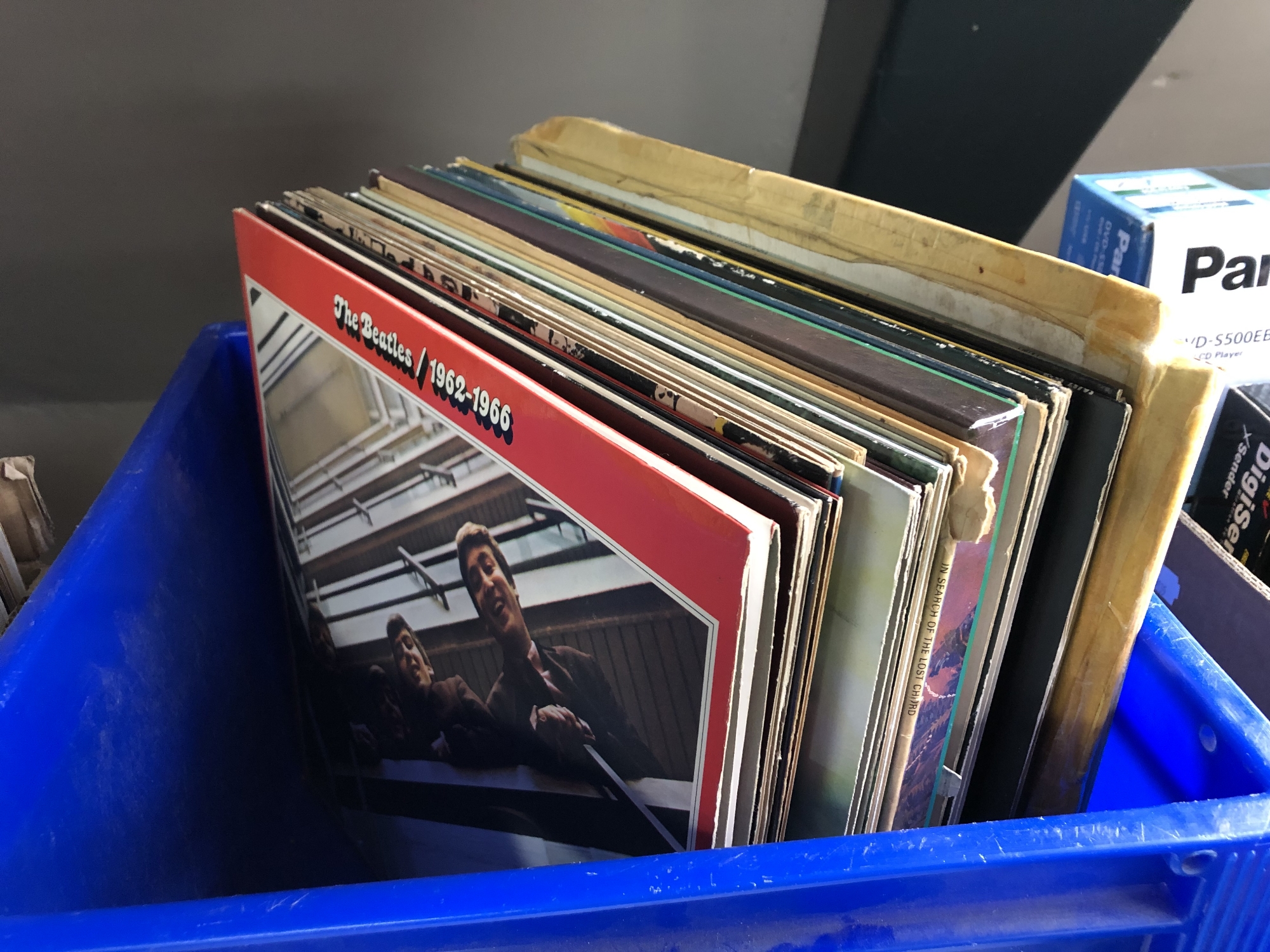 A box of vinyl records including The Beatles,