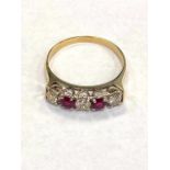 A yellow gold diamond and ruby half eternity ring, approximately 0.45ct.