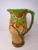 A Carlton Ware ribbed jug decorated with an oak tree,