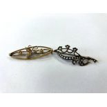 A 15ct gold brooch set with seed pearls,