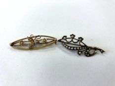 A 15ct gold brooch set with seed pearls,