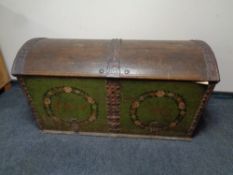 A 19th century metal bound oak domed shipping trunk