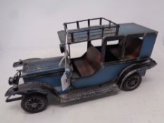 A decorative metal model car, length 39 cm.