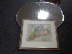 A 20th century oval frameless bevelled mirror together with a watercolour - Garden scene initialled