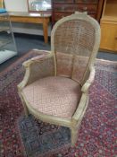 An antique French begerre backed armchair