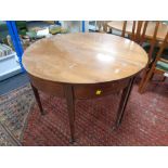 A 19th century inlaid mahogany circular dining table