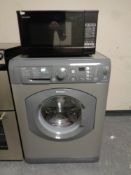 A Hotpoint Aquarius plus washing machine together with Sharp microwave