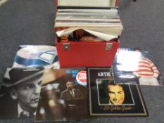 A record case containing vinyl LP's including Linda Romstadt, Louis Armstrong,