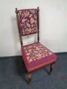 An Edwardian hall chair upholstered in tapestry fabric