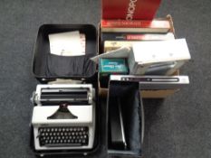 A cased Erika typewriter together with a paper shredder, box containing board games,