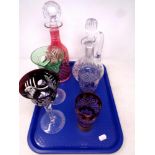 A tray of cut glass two tone decanter, pair of wine glasses and beakers,