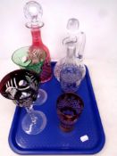 A tray of cut glass two tone decanter, pair of wine glasses and beakers,