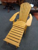 A pine garden steamer armchair with cushion