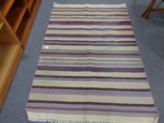 A striped kilim rug,
