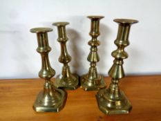 Two pairs of brass candlesticks