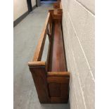 A pitch pine church pew, length 296 cm.