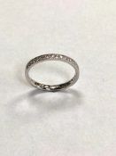 A platinum diamond half eternity ring, approximately 0.21ct.