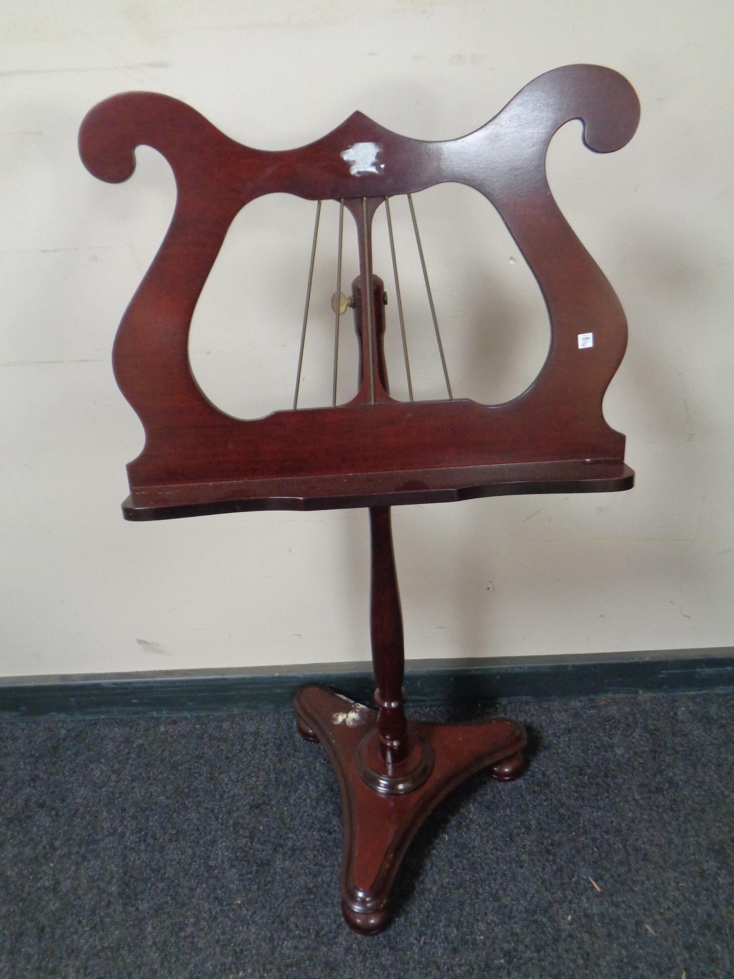 An adjustable lyre music stand