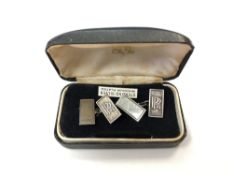 A pair of Rolls Royce silver cuff links,