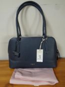 A Radley London blue leather bag with protective outer bag