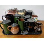A tray of lidded steins and jugs