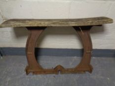 A rustic side table on heavy cast iron base