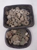 Two tubs of metal detector finds and other excavated items.