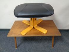 A black leather upholstered footstool together with a 20th century coffee table