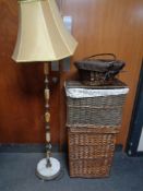 A brass and onyx standard lamp with shade together with three assorted wicker baskets