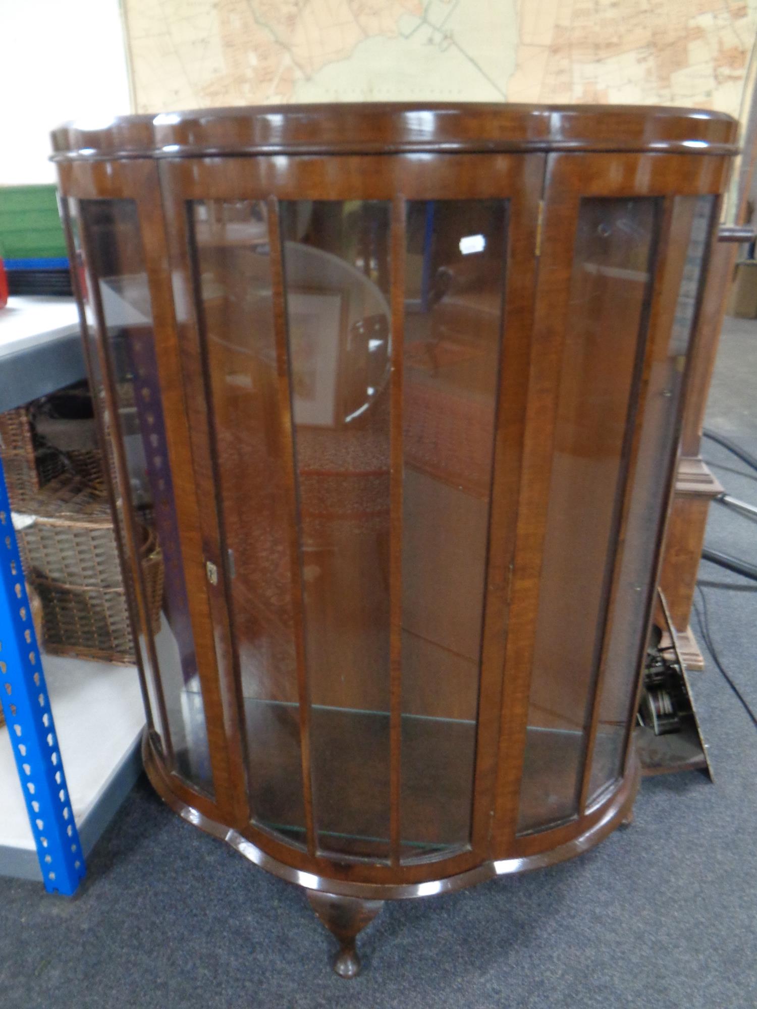 A mid century walnut shaped fronted display cabinet