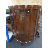 A mid century walnut shaped fronted display cabinet