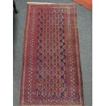 An Afghan rug of geometric design,