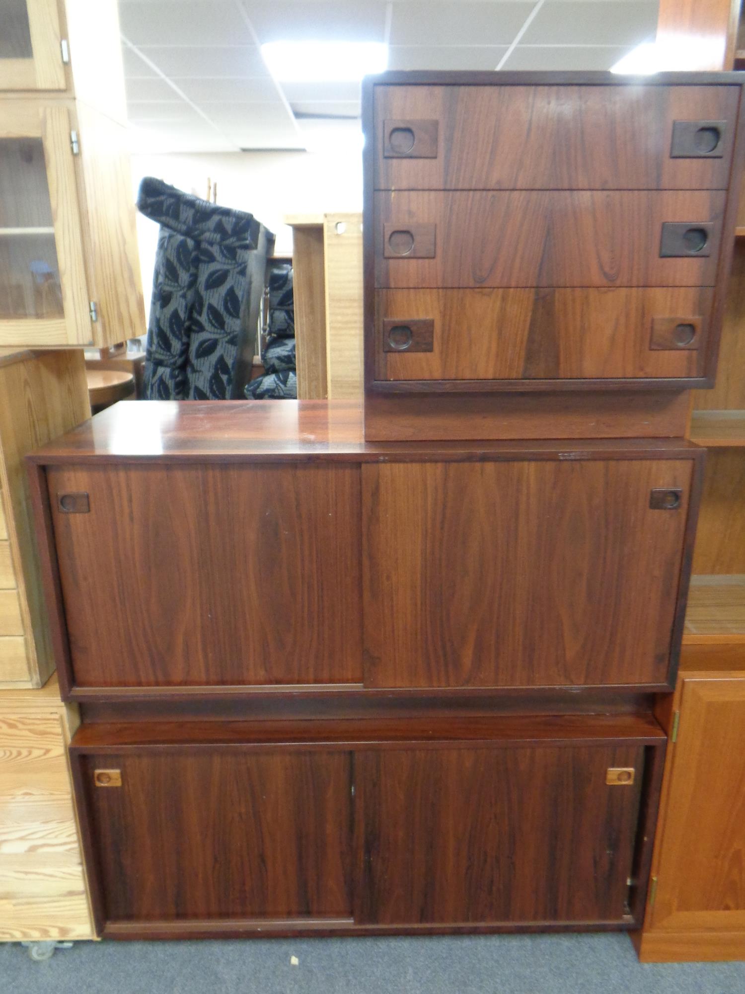 A pair of mid century Danish double sliding door low cupboards together with matching three drawer