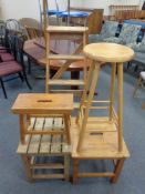 A set of vintage pine folding step ladders together with four pine stools and crackets