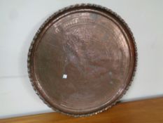 A 19th century copper scalloped edged tray, diameter 40 cm.