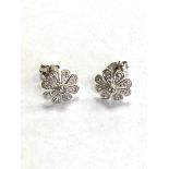 A 9ct white gold diamond set flower stud earrings
