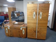 A 20th century double door gentleman's wardrobe together with matching dressing chest in a walnut